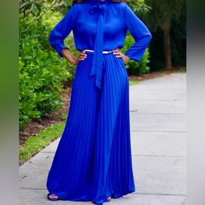 Blue mock neck pleated wide leg belted jumpsuit